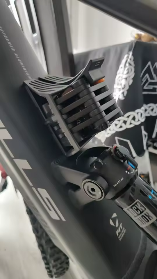 Folded lock mounted on a black e-bike frame